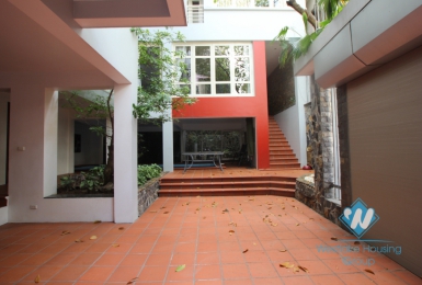 L-shaped modern house with swimming pool in Au Co street